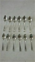 12 spoons all marked Sterling