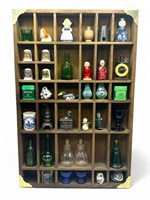 Wooden display shelf of miniatures