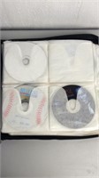 38 DVD/CD Lot With Carrying Case