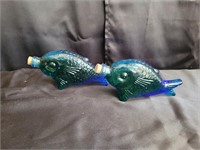 Glass fish bottles filled with oil. 9ins.