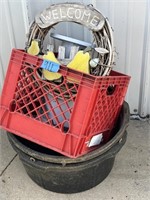 welcome sign, milk crate, 2 rubber tubs