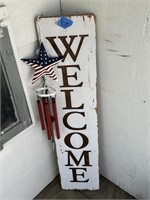 welcome sign and windchime