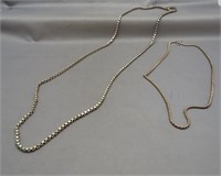 (2) Sterling silver necklaces of various sizes.