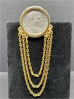 Greek coin with three strands of chains.