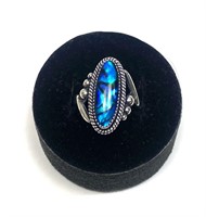 Sterling silver bezel set oval blue paua ring,