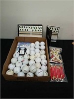 Golf balls, score cards, pencils, and tees