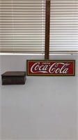 Drink Coca Cola sign and tin box with marbles