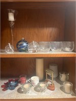 Assorted candles and oil lamps