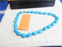 SHORT BLUE BEADED NECKLACE