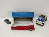 toys: tin house, Tonka truck, Dinky Toy Volkswagen