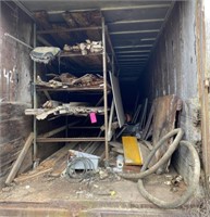 Contents of Trailer: Wood Trim, Boards, Poly Tarp