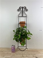 Hanging iron planter with artificial plant