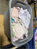 Tote of baby blankets and crib sheets