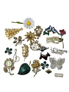 Large grouping of brooches signed plus