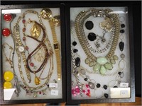 Two containers of costume jewelry mostly