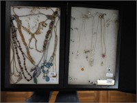 Two containers of costume jewelry, mostly