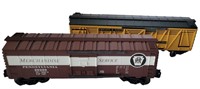 TWO LIONEL BOXCARS IN LIKE NEW CONDITION.
