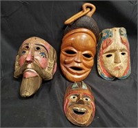 Group of carved wood ethnic masks