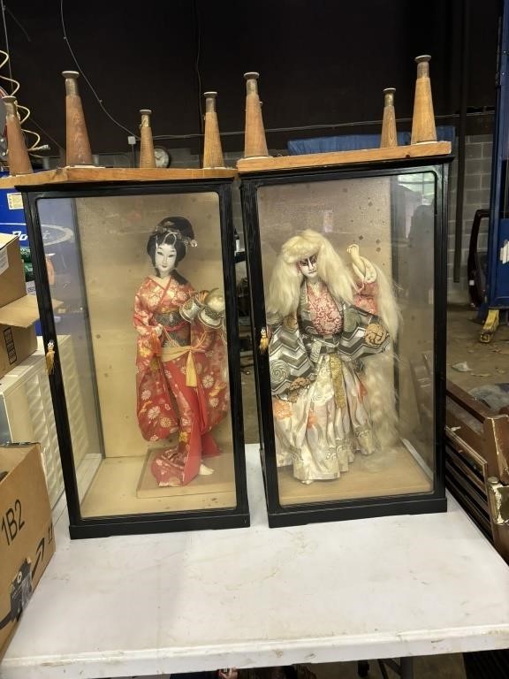 2 japanese dolls in glass cases on wood stands &
