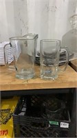 Two glass beer mugs and jugs