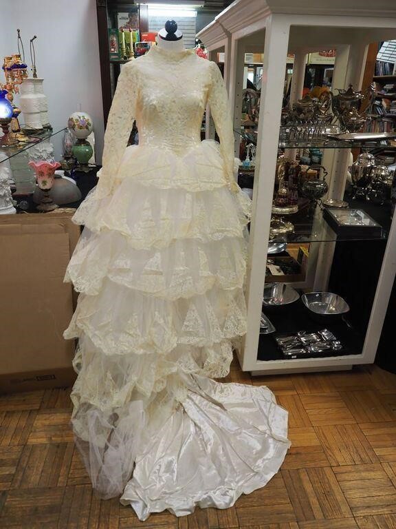 Vintage tiered wedding dress with cathedral