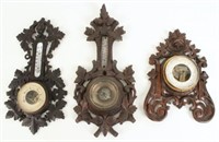Three Black Forest Carved Barometers/Thermometers