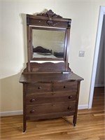 Antique three drawer dresser with beveled mirror