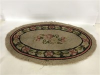 Oval floral hooked rug