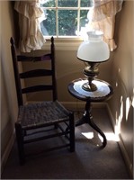 Chair, table, and antique lamp