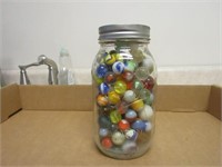 Antique marbles in jar.