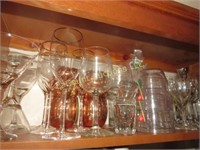 all glass barware on shelf packers