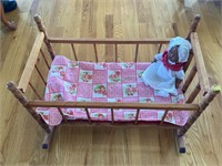 Vintage baby doll crib rocker, with an antique