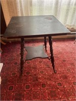 Side table with what appears to be cast iron feet