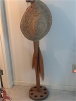 Fishing pole stand with 2  straw hats, one