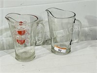 2 vintage heavy glass pitchers