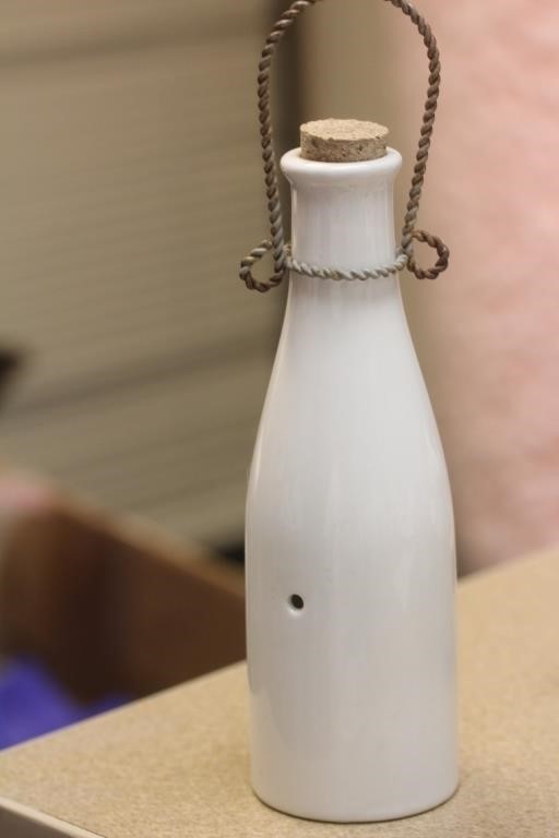 A Milk Porcelain Bottle Bell
