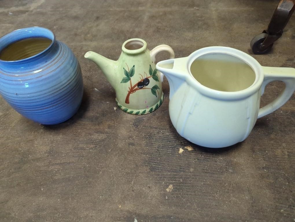 crock pitchers and a vase