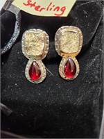 Silver earrings w/ red stone