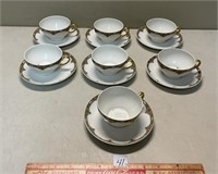 SEVEN LIMOGES ELITE GOLD TRIM TEA CUPS AND SAUCER