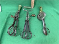 3 vintage egg beaters with green wooden handles