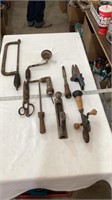 Vintage manual drill, vintage hand saw