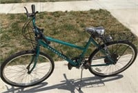 Roadmaster, metallic teal colored bicycle