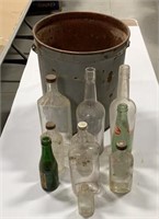 Metal bucket with misc bottles