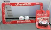 Coca-Cola golf balls, license plate frame, die