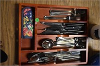 flatware in wooden drawer divider