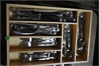 flatware in wooden drawer divider