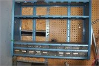 metal shelving unit with drawers full of fasteners