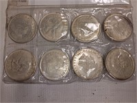 Eight Silver Toned Tokens