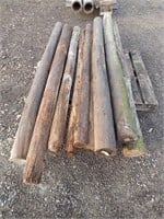 10 Wooden fence posts; approx. 6-7' long