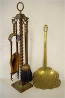 Set of brass fire tools on stand & a brass scoop